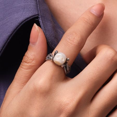 Octopus Holding Carved Skull Pearl Ring